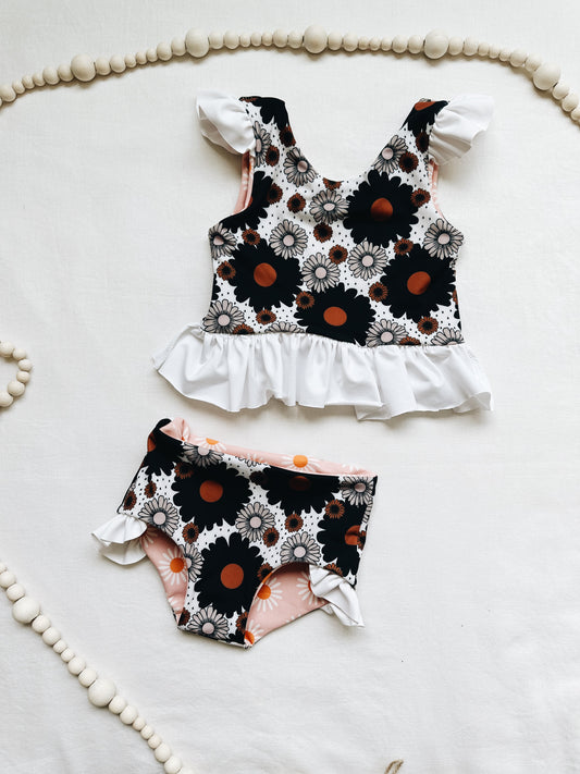 Black and white polka dot floral ruffle reversible swim suit